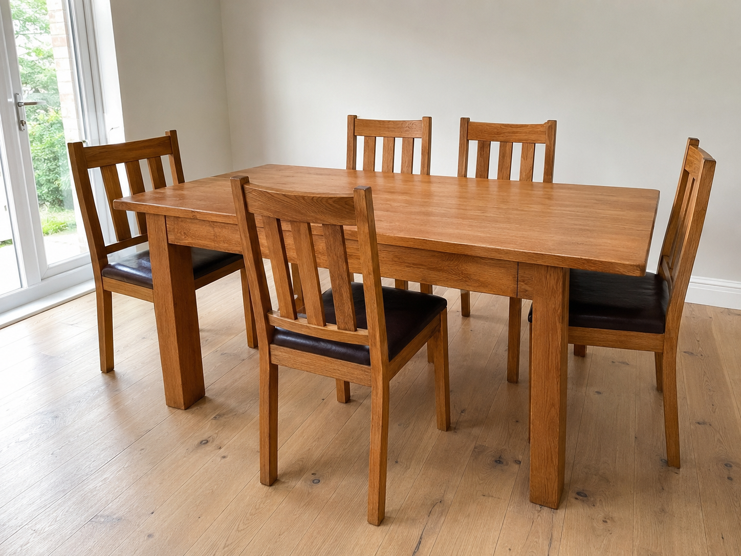 Solid oak dining table with six matching chairs